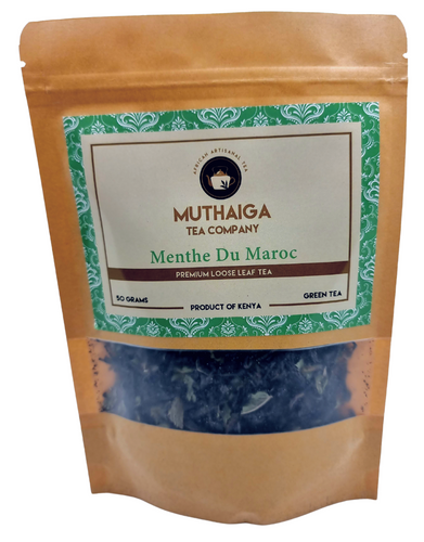 Packaging of MUTHAIGA TEA COMPANY's Menthe Du Maroc, a Detox Green Tea], showing the loose leaf  tea leaves inside a transparent window and the label with product name and brand.