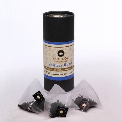 A package of Muthaiga Railway Roast loose leaf green tea benefits with pyramid bags displayed in front.